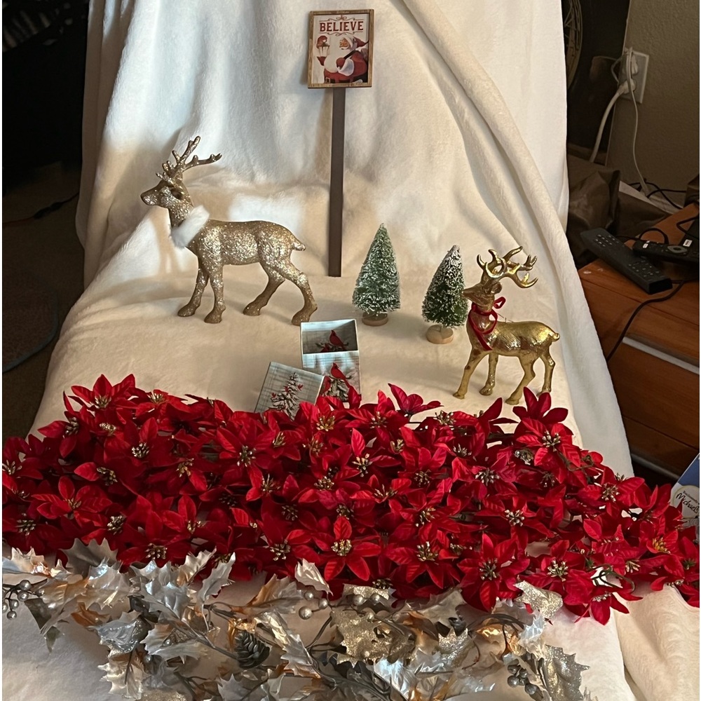 2 reindeer from macys. 2 red garland 1 silver metallic leaf garland. 2 trees